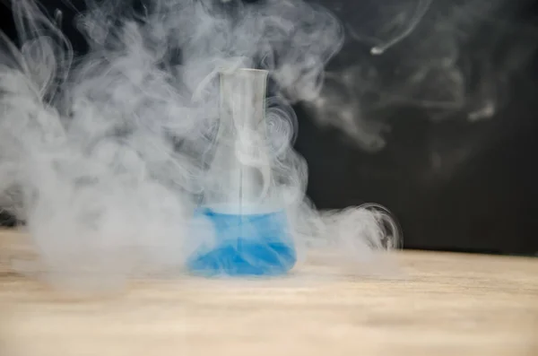 Flask Blue Liquid Smoke Black Background Chemical Analysis — Stock Photo, Image