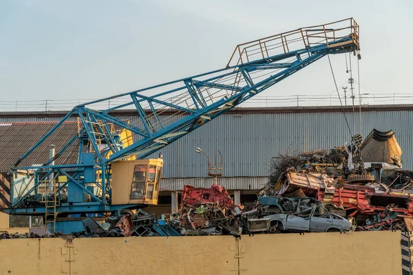 crane grab loading scrap metal. industry concept. Delivery of scrap metal