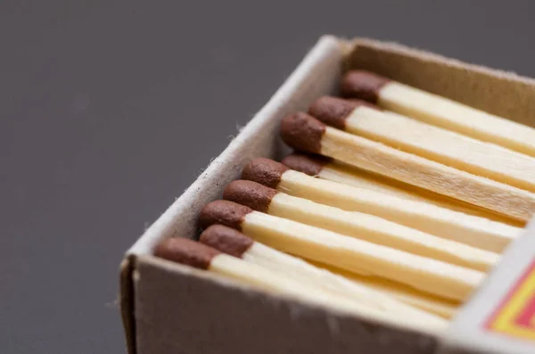 Matches in box, dark background. Macro photography. Close-up shot. Matches in open match-box on black background — Stock Image Matches Box Dark Background Macro Photography Close Shot Matches Open Stock Picture
