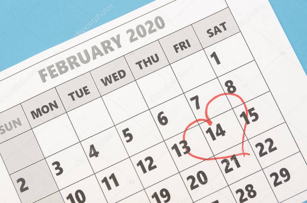 Valentine's day is marked with a heart on the calendar. Holiday concept