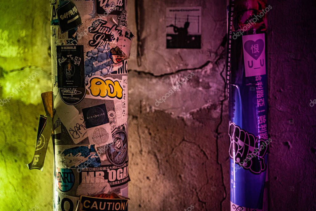 A electric light column at a street in Tainan.There are some stickers on the column surface.