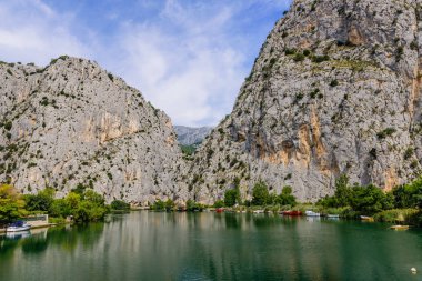 Picturesque rocky banks of the Cetina river in Omis town, Dalmatia region, Croatia. clipart