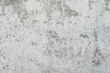 Çizik ve çatlaklarla dolu bir duvar parçası.
