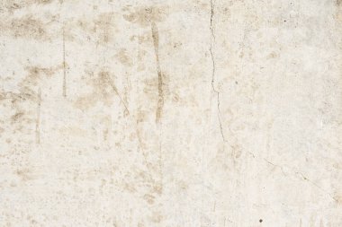 Çizik ve çatlaklarla dolu bir duvar parçası.