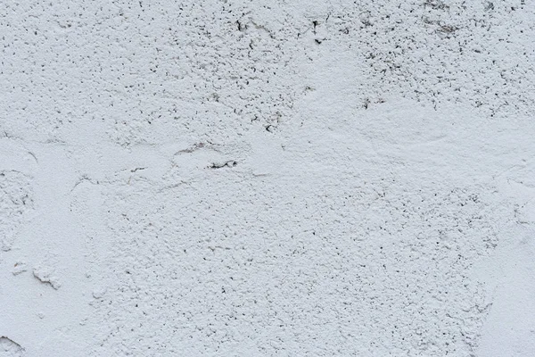 Çizik ve çatlaklarla dolu bir duvar parçası.