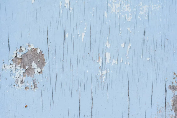 Çizik ve çatlaklarla dolu bir duvar parçası.