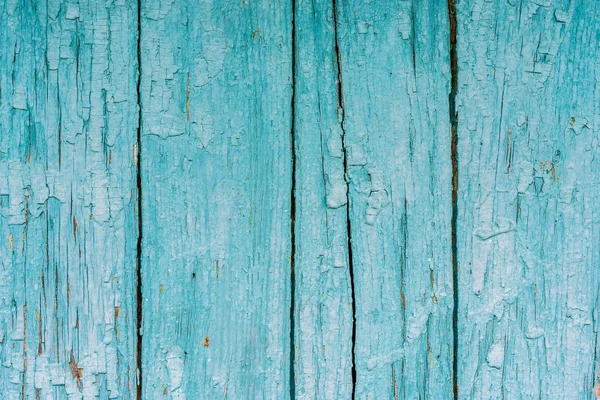 Çizik ve çatlaklarla dolu bir duvar parçası.