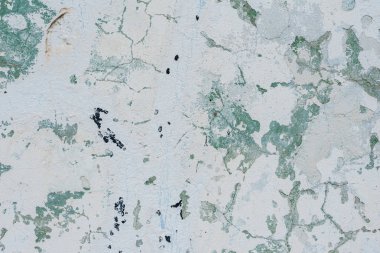 Çizik ve çatlaklarla dolu bir duvar parçası.