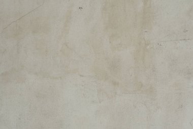 Çizik ve çatlaklarla dolu bir duvar parçası.