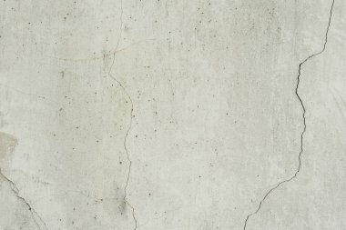 Çizik ve çatlaklarla dolu bir duvar parçası.