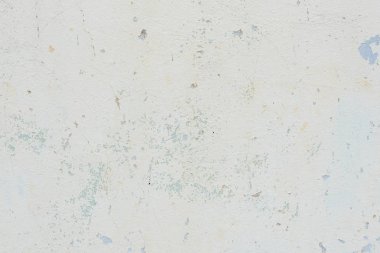 Çizik ve çatlaklarla dolu bir duvar parçası.