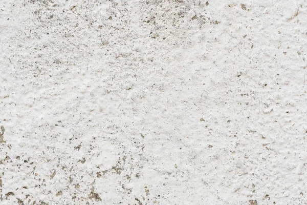 Çizik ve çatlaklarla dolu bir duvar parçası.