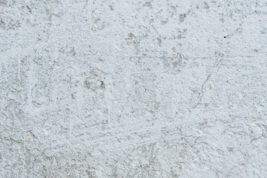 Çizikler ve çatlaklar ile duvar parçası. Arka plan olarak kullanılabilir