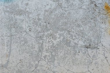 Çizikler ve çatlaklar ile duvar parçası. Arka plan olarak kullanılabilir