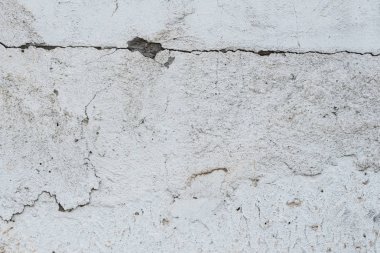 Çizikler ve çatlaklar ile duvar parçası. Arka plan olarak kullanılabilir