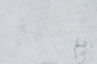 Çizikler ve çatlaklar ile duvar parçası. Arka plan olarak kullanılabilir