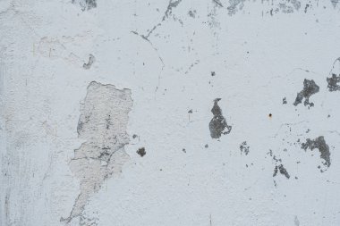 Çizikler ve çatlaklar ile duvar parçası. Arka plan olarak kullanılabilir