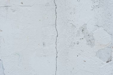 Çizikler ve çatlaklar ile duvar parçası. Arka plan olarak kullanılabilir