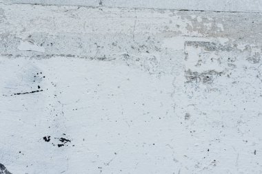 Çizikler ve çatlaklar ile duvar parçası. Arka plan olarak kullanılabilir