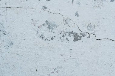 Çizikler ve çatlaklar ile duvar parçası. Arka plan olarak kullanılabilir