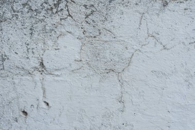 Çizikler ve çatlaklar ile duvar parçası. Arka plan olarak kullanılabilir