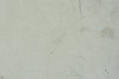 Çizikler ve çatlaklar ile duvar parçası. Arka plan olarak kullanılabilir