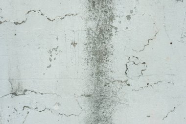 Çizikler ve çatlaklar ile duvar parçası. Arka plan olarak kullanılabilir