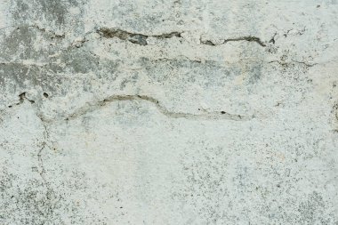 Çizikler ve çatlaklar ile duvar parçası. Arka plan olarak kullanılabilir