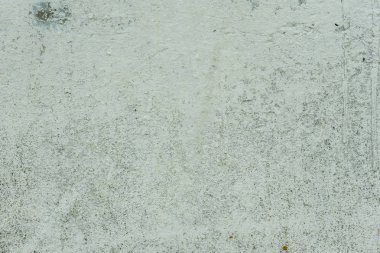 Çizikler ve çatlaklar ile duvar parçası. Arka plan olarak kullanılabilir