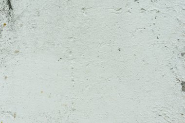 Çizikler ve çatlaklar ile duvar parçası. Arka plan olarak kullanılabilir