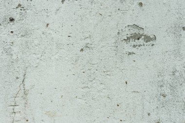 Çizikler ve çatlaklar ile duvar parçası. Arka plan olarak kullanılabilir