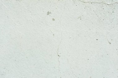 Çizikler ve çatlaklar ile duvar parçası. Arka plan olarak kullanılabilir