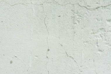 Çizikler ve çatlaklar ile duvar parçası. Arka plan olarak kullanılabilir