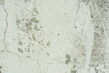 Çizikler ve çatlaklar ile duvar parçası. Arka plan olarak kullanılabilir