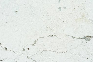 Çizikler ve çatlaklar ile duvar parçası. Arka plan olarak kullanılabilir