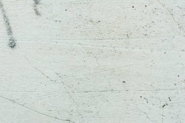 Çizikler ve çatlaklar ile duvar parçası. Arka plan olarak kullanılabilir