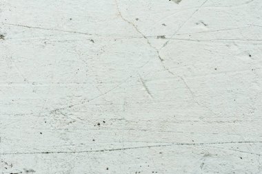 Çizikler ve çatlaklar ile duvar parçası. Arka plan olarak kullanılabilir