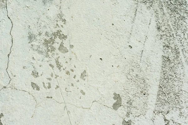 Çizikler ve çatlaklar ile duvar parçası. Arka plan olarak kullanılabilir