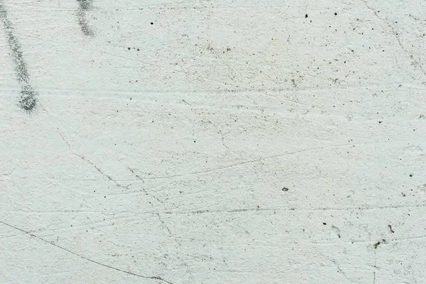 Çizikler ve çatlaklar ile duvar parçası. Arka plan olarak kullanılabilir