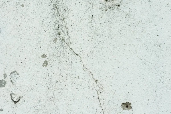 Çizikler ve çatlaklar ile duvar parçası. Arka plan olarak kullanılabilir