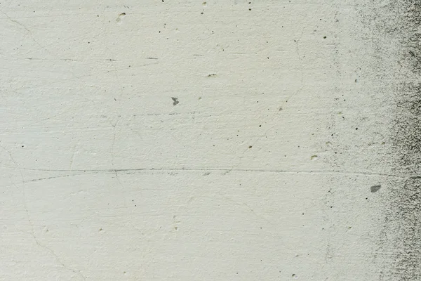 Çizikler ve çatlaklar ile duvar parçası. Arka plan olarak kullanılabilir