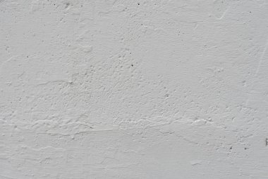 Çizikler ve çatlaklar ile duvar parçası. Arka plan olarak kullanılabilir