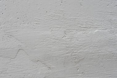 Çizikler ve çatlaklar ile duvar parçası. Arka plan olarak kullanılabilir