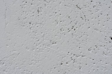 Çizikler ve çatlaklar ile duvar parçası. Arka plan olarak kullanılabilir