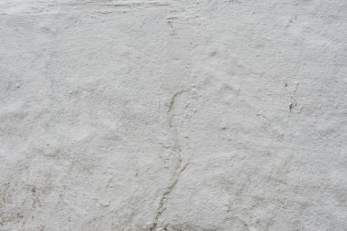 Çizikler ve çatlaklar ile duvar parçası. Arka plan olarak kullanılabilir