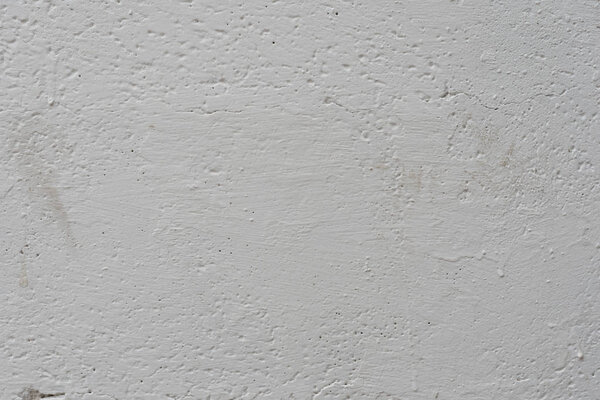 Фрагмент стены с царапинами и трещинами. Его можно использовать в качестве фона
