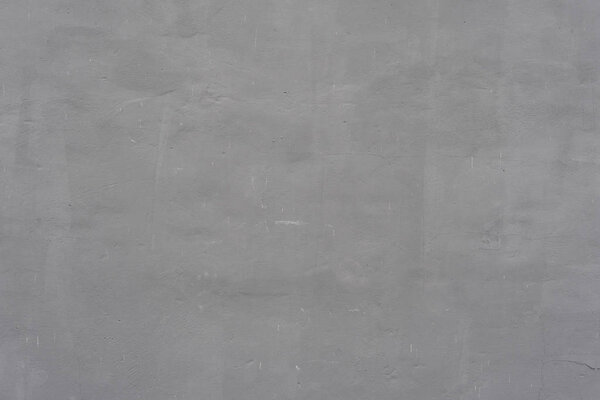 Фрагмент стены с царапинами и трещинами. Его можно использовать в качестве фона
