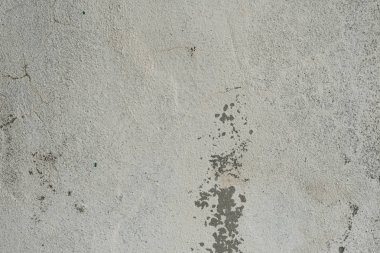 Çizikler ve çatlaklar ile duvar parçası. Arka plan olarak kullanılabilir