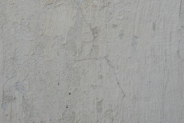 Çizikler ve çatlaklar ile duvar parçası. Arka plan olarak kullanılabilir