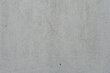 Çizikler ve çatlaklar ile duvar parçası. Arka plan olarak kullanılabilir